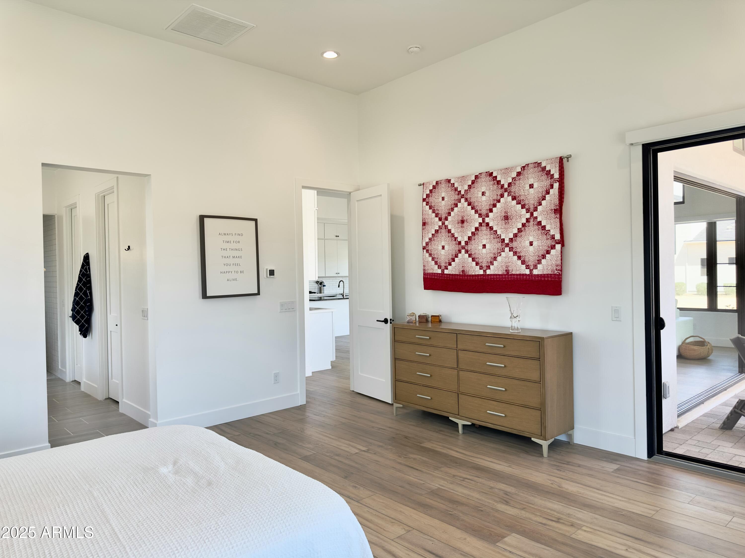 2725 East Derringer Court Gilbert, AZ 85297 - Photo 16 of 56 a bedroom with a bed and a dresser