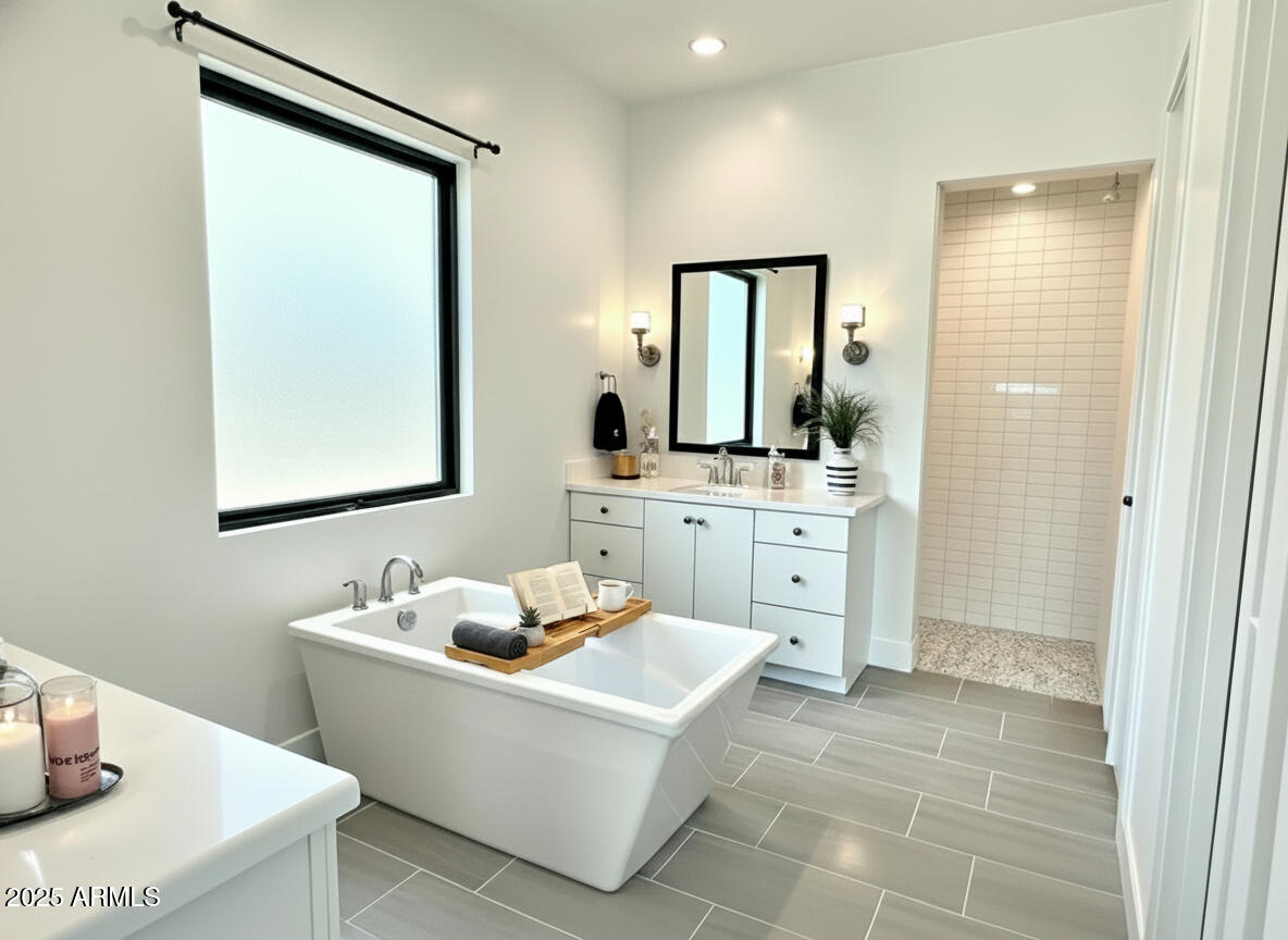 2725 East Derringer Court Gilbert, AZ 85297 - Photo 19 of 56 a bathroom with a double vanity sink mirror and bathtub