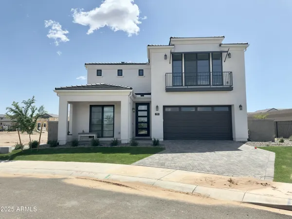 a view of a house with a yard in front of it
