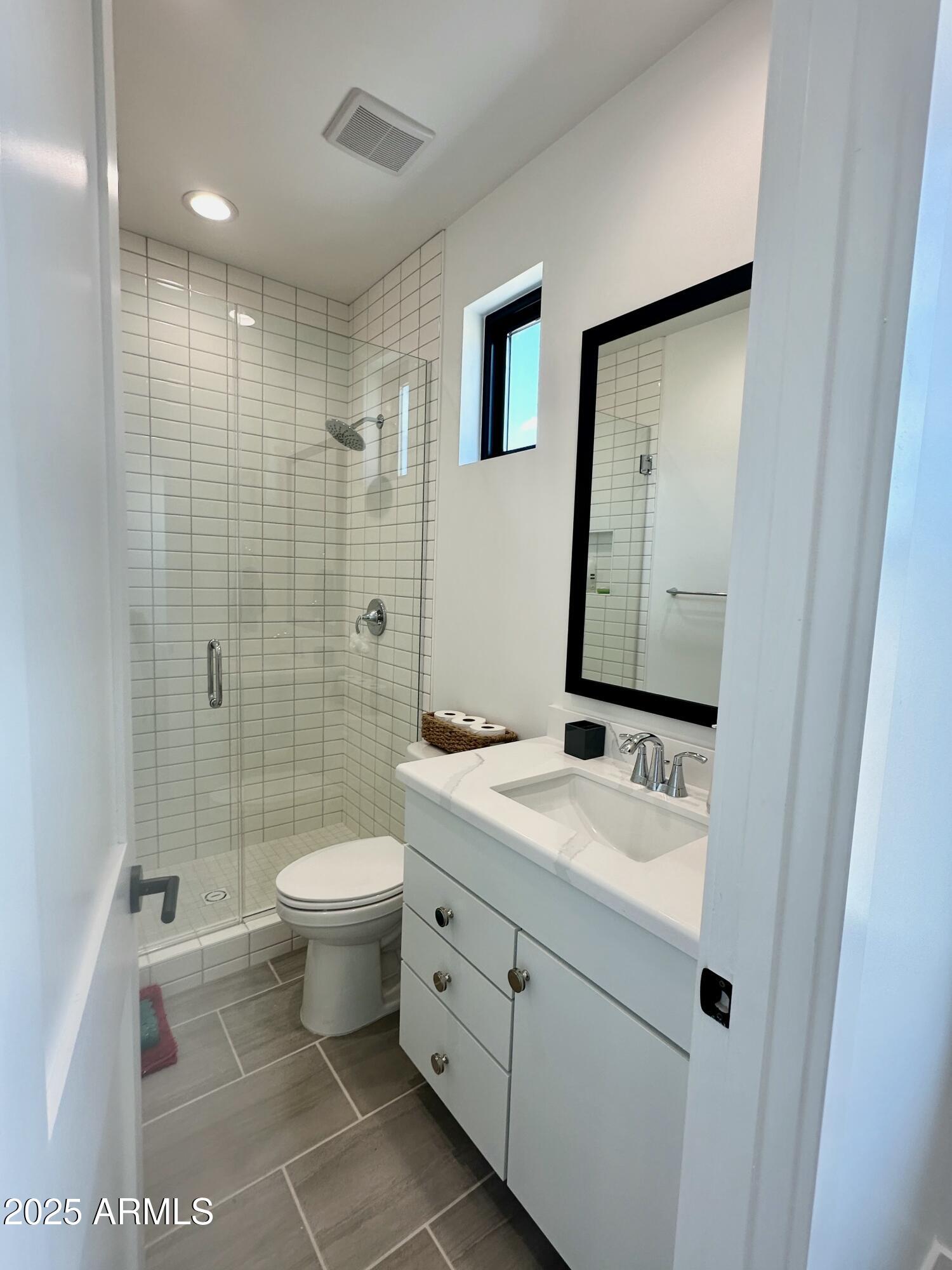 2725 East Derringer Court Gilbert, AZ 85297 - Photo 24 of 56 a bathroom with a sink a toilet and shower