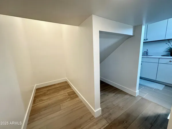 a living room with furniture a mirror and a fireplace