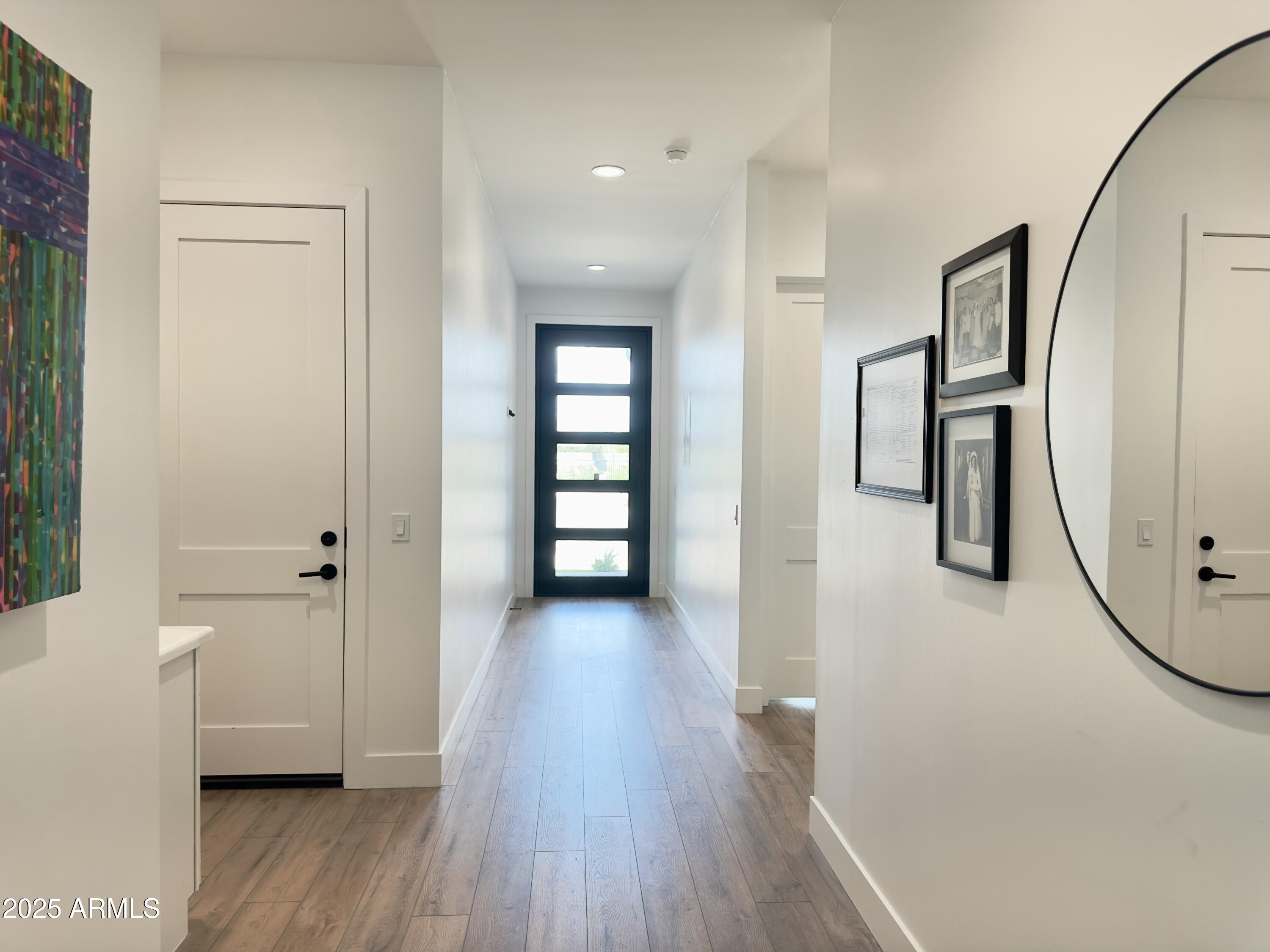 2725 East Derringer Court Gilbert, AZ 85297 - Photo 4 of 56 a view of a hallway with wooden floor and entryway