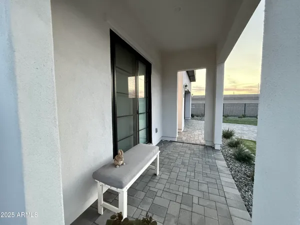 a outdoor space with patio lots of furniture and umbrella