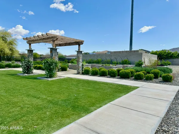 a view of a rooftop with chairs and a patio