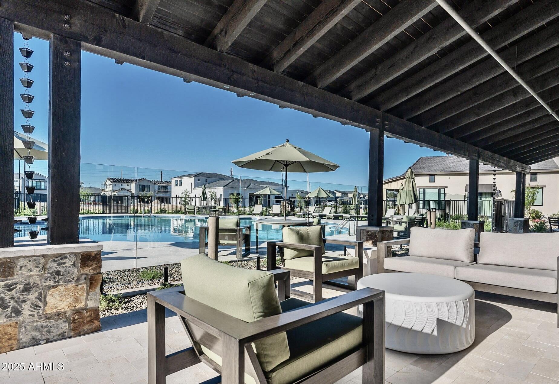 2725 East Derringer Court Gilbert, AZ 85297 - Photo 50 of 56 a outdoor space with patio lots of furniture and umbrella