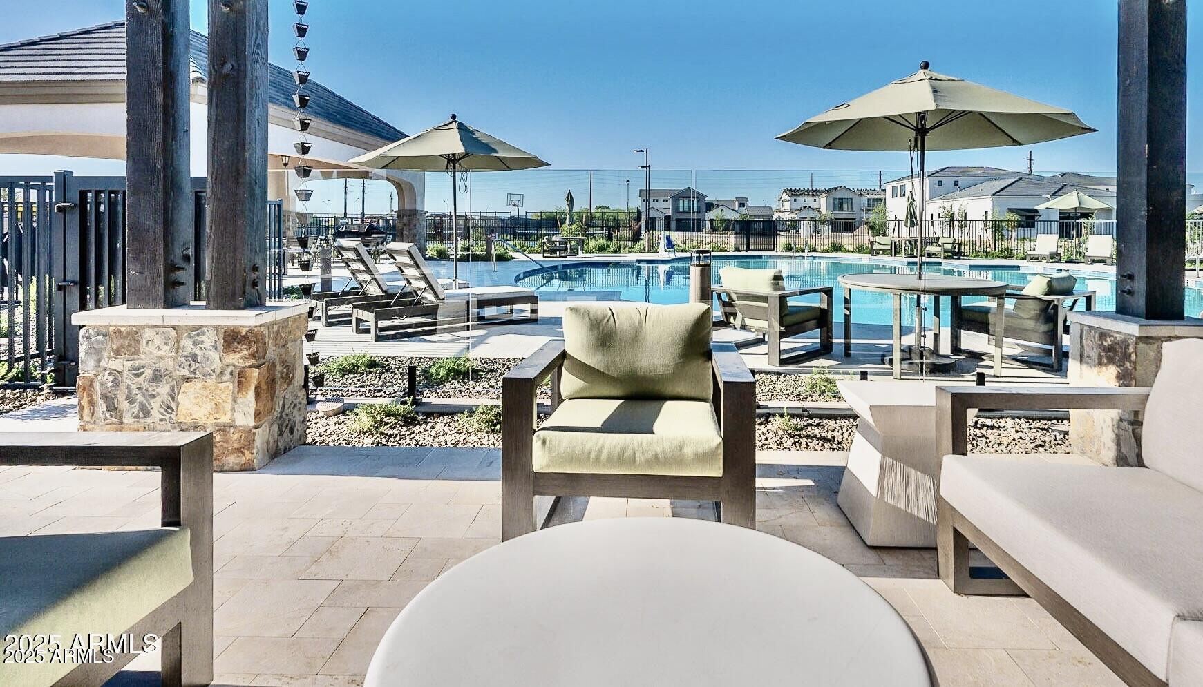 2725 East Derringer Court Gilbert, AZ 85297 - Photo 51 of 56 a view of a rooftop with chairs and a patio