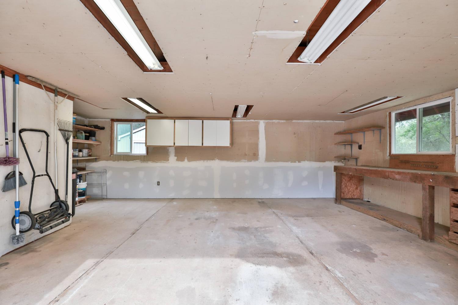 4773 Jacarah Road Placerville, CA 95667 - Photo 82 of 94 Worksop & storage in downstairs of Barn.