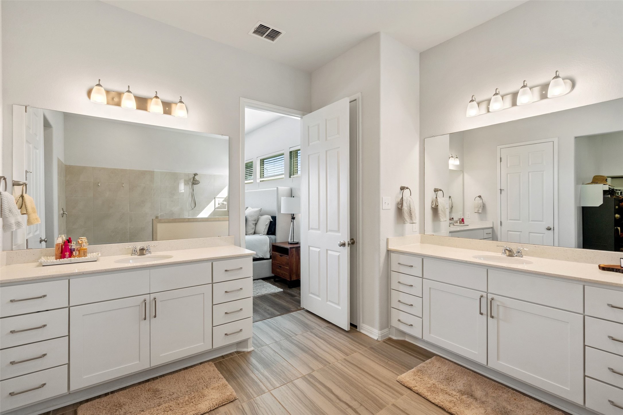 162 Lunar Loop Austin, TX 78737 - Photo 15 of 40 a spacious bathroom with a double vanity sink mirror and