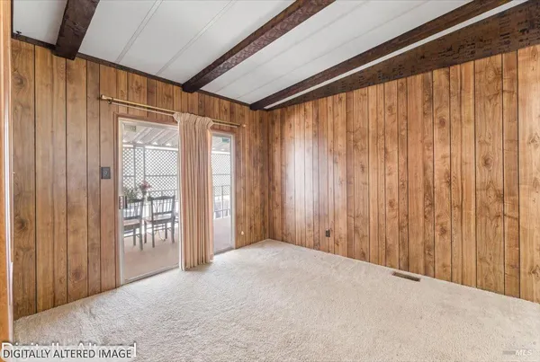 a view of a room with a balcony and wooden walls