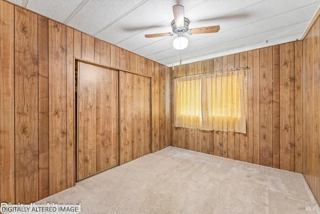 a view of a livingroom with a chandelier fan