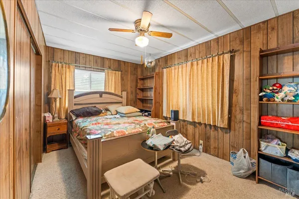 a bedroom with furniture and a window