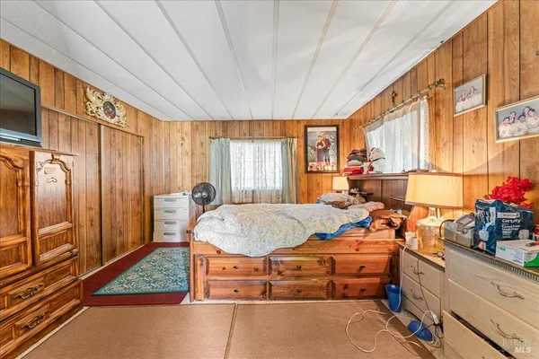 a bed room with a bed and a window