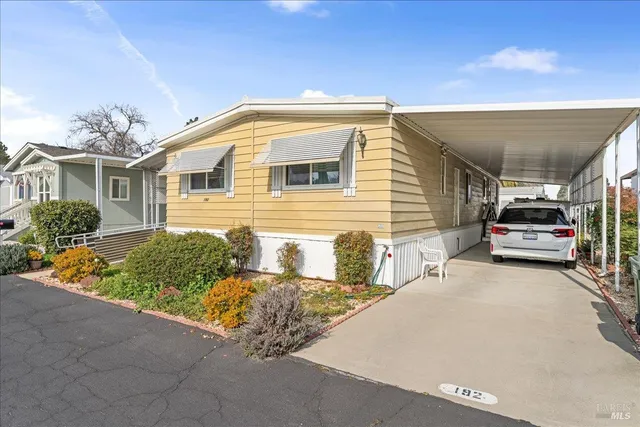 a view of a house with a street