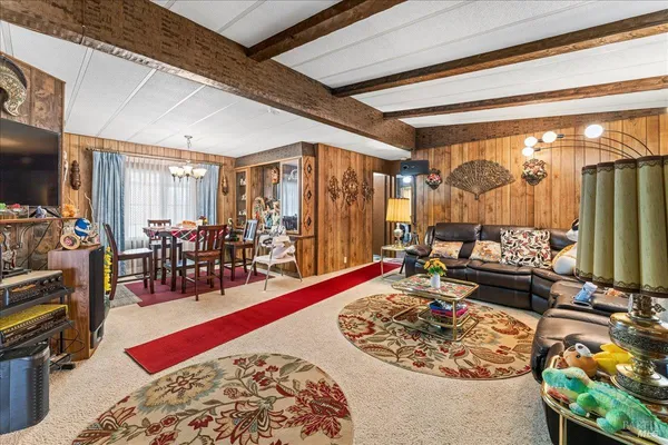 a very nice looking room with a large window and a rug