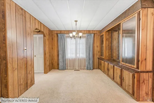 a view of a hallway with windows