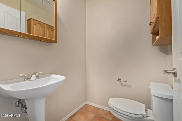 a spacious bathroom with a shower sink and mirror