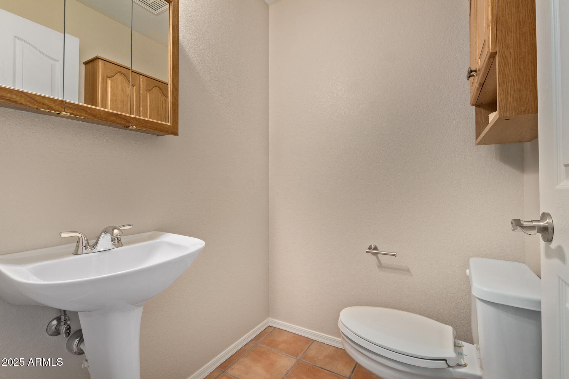 6001 East Southern Avenue, Unit 4 Mesa, AZ 85206 - Photo 18 of 23 a bathroom with a sink a toilet and mirror