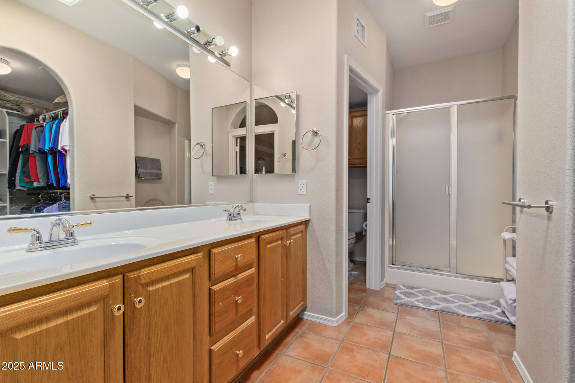 6001 East Southern Avenue, Unit 4 Mesa, AZ 85206 - Photo 20 of 23 a spacious bathroom with a shower sink and mirror