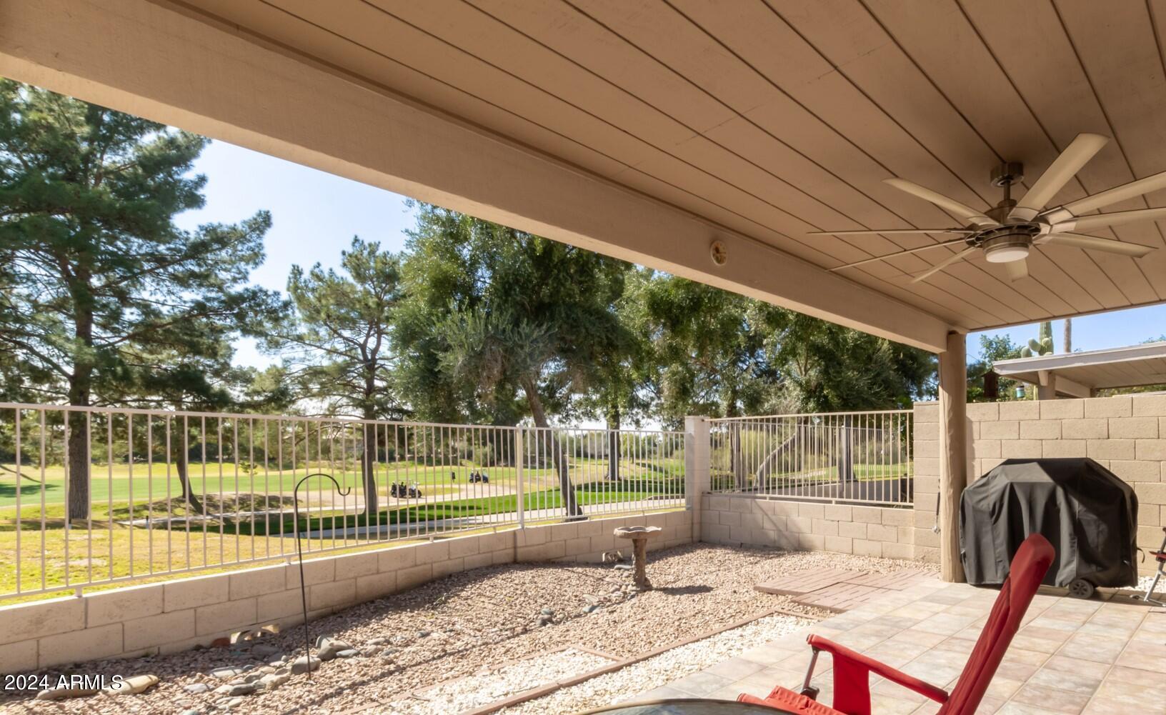 6001 East Southern Avenue, Unit 4 Mesa, AZ 85206 - Photo 2 of 23 a view of a porch with a table and chairs
