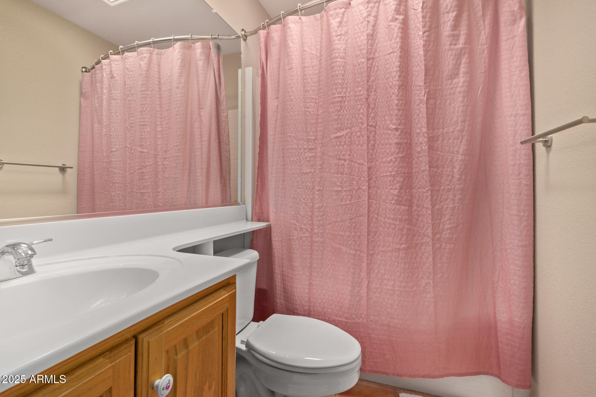6001 East Southern Avenue, Unit 4 Mesa, AZ 85206 - Photo 22 of 23 a bathroom with a sink a toilet and shower curtain