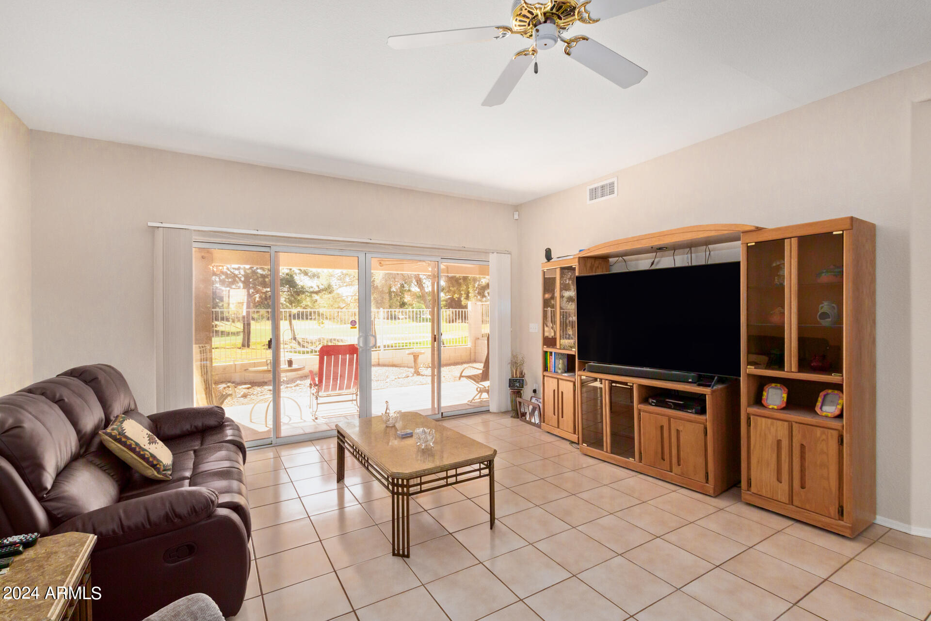 6001 East Southern Avenue, Unit 4 Mesa, AZ 85206 - Photo 3 of 23 a living room with furniture and a flat screen tv