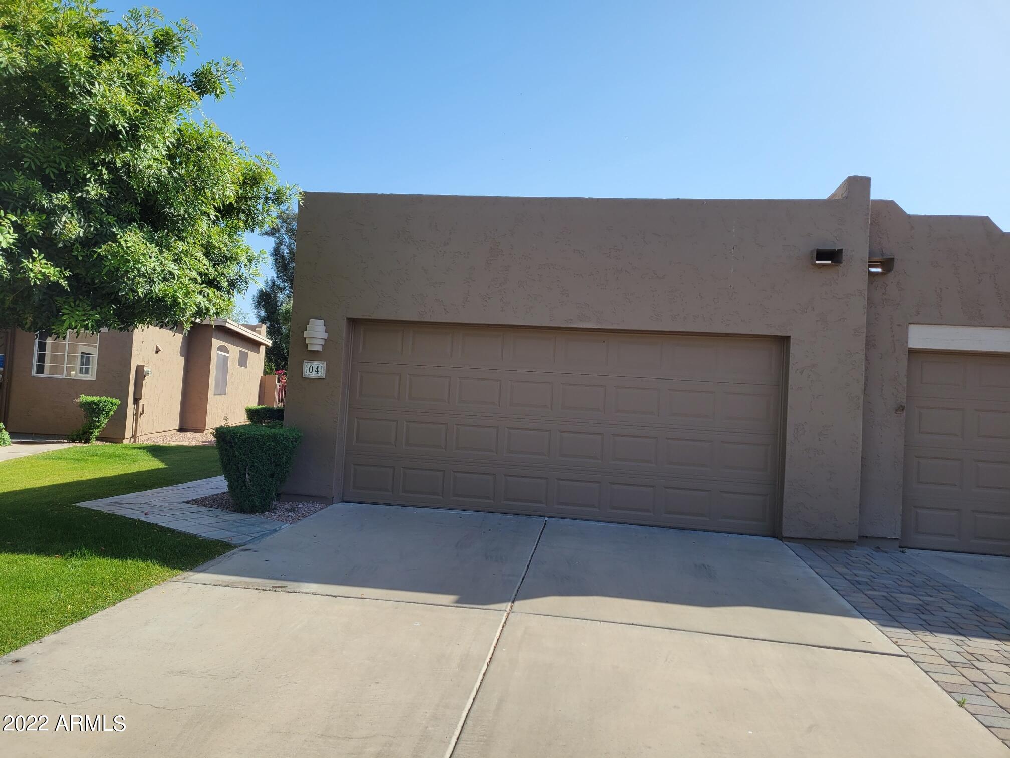6001 East Southern Avenue, Unit 4 Mesa, AZ 85206 - Photo 7 of 23 front view of a house with a yard