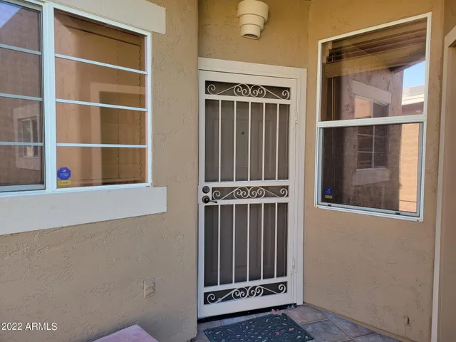a view of a door and a window