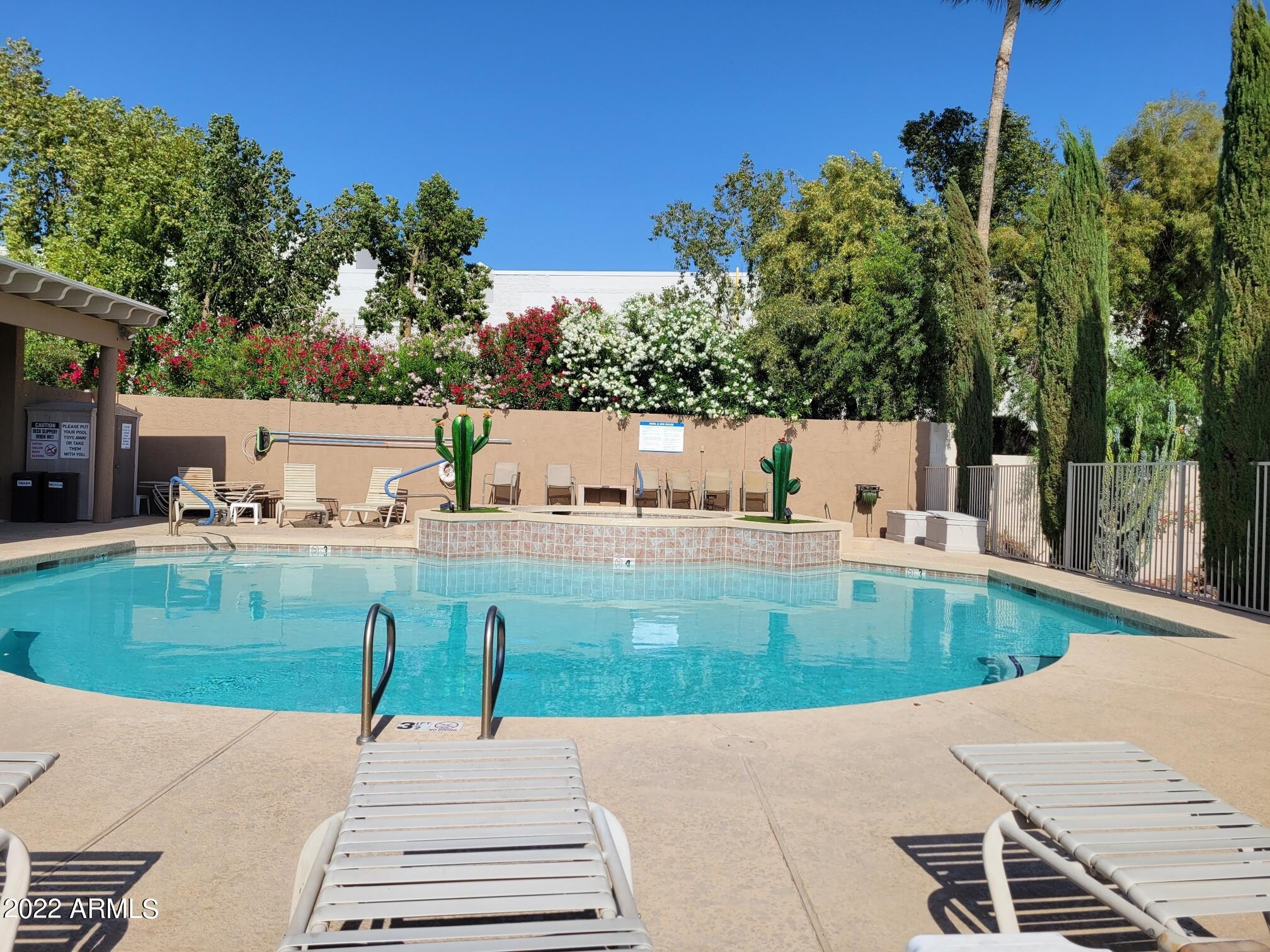 6001 East Southern Avenue, Unit 4 Mesa, AZ 85206 - Photo 10 of 23 a view of a swimming pool and a yard