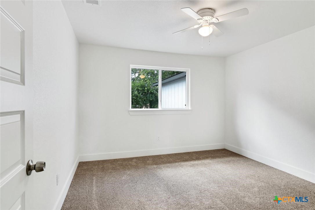 1920 Royal Loop Belton, TX 76513 - Photo 9 of 15 an empty room with a window and a fan