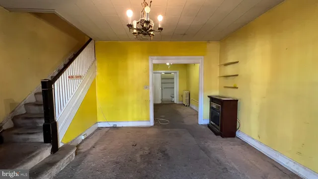 a view of a hallway with paintings on the wall