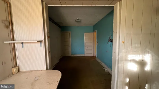 a bathroom with a glass door shower