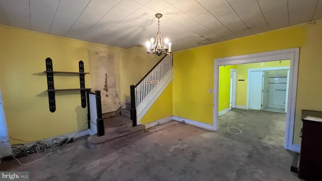 a view of empty room with painted walls