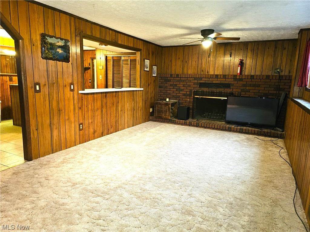 3089 Batdorf Road Wooster, OH 44691 - Photo 9 of 21 The enormous family room in the lower walk-out basement. To the left of the wall is the bar area.