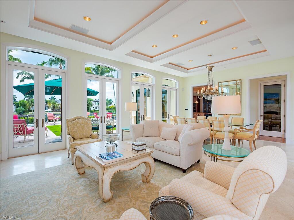 3580 Gin Lane Naples, FL 34102 - Photo 16 of 38 a living room with furniture and a table