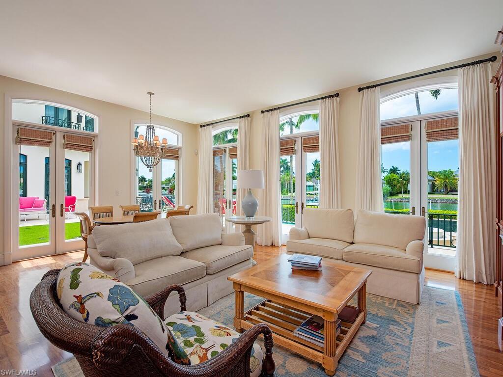 3580 Gin Lane Naples, FL 34102 - Photo 17 of 38 a living room with furniture and a large window