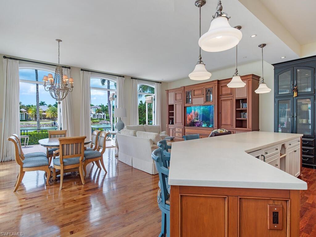 3580 Gin Lane Naples, FL 34102 - Photo 20 of 38 a view of a dining room with furniture window and wooden floor