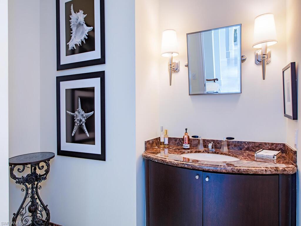 3580 Gin Lane Naples, FL 34102 - Photo 24 of 38 a bathroom with a granite countertop sink and a mirror