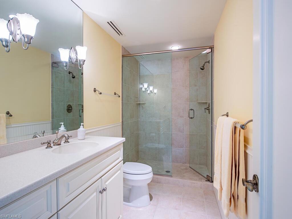 3580 Gin Lane Naples, FL 34102 - Photo 29 of 38 a bathroom with a sink a toilet and shower
