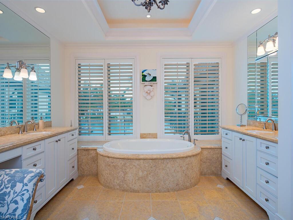 3580 Gin Lane Naples, FL 34102 - Photo 37 of 38 a living room with furniture and a large window