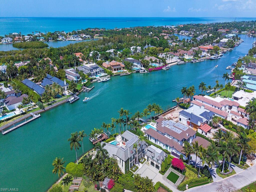 3580 Gin Lane Naples, FL 34102 - Photo 7 of 38 an aerial view of residential houses with outdoor space and river