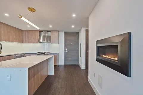 a kitchen with a sink and a stove top oven