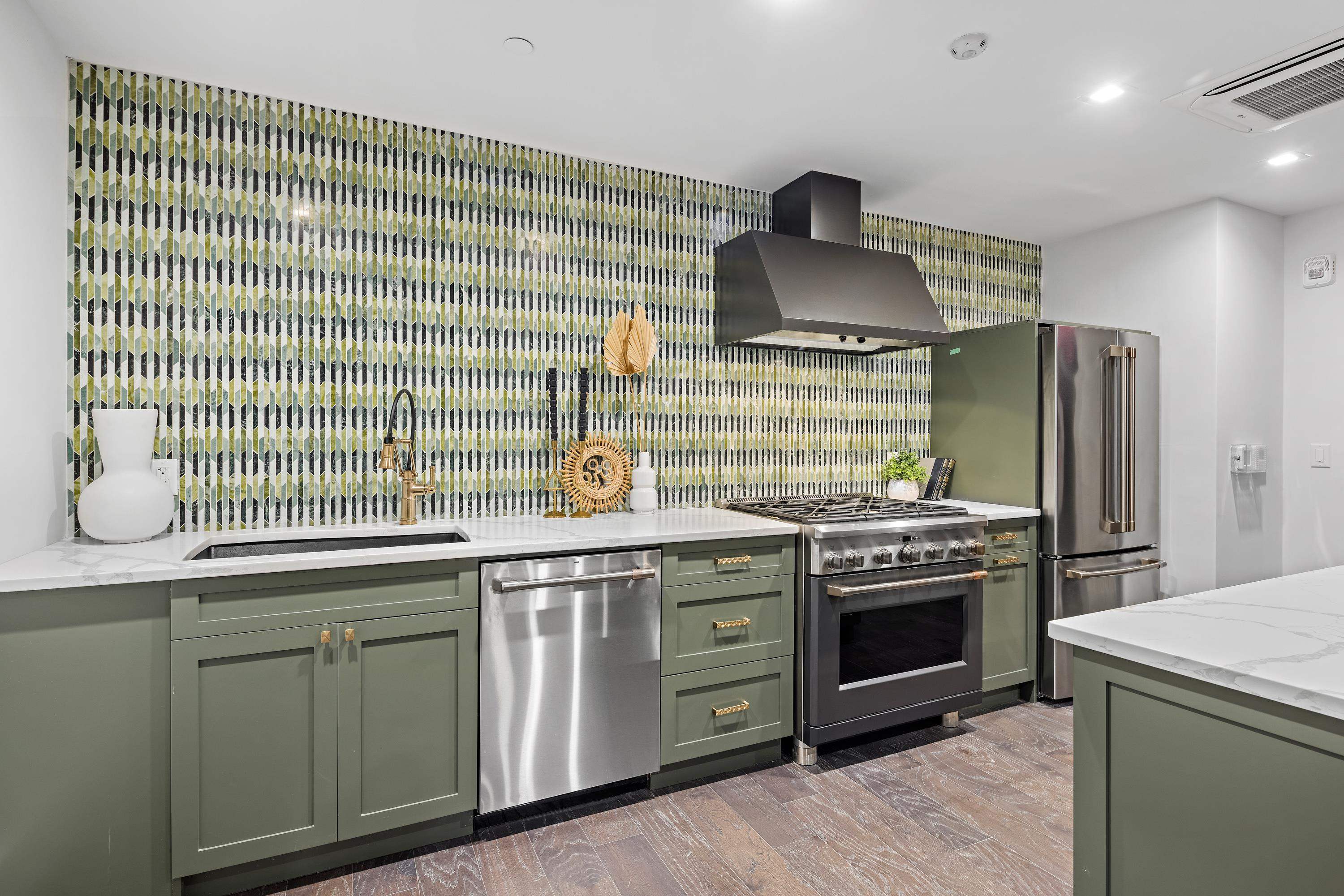 8701 Churchill Road, Unit 502 North Bergen, NJ 07047 - Photo 31 of 37 a kitchen with stainless steel appliances granite countertop a sink stove and refrigerator