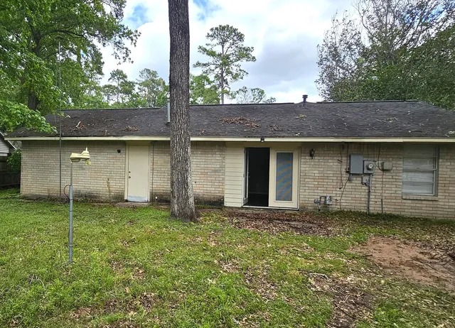 a view of a house with a garden