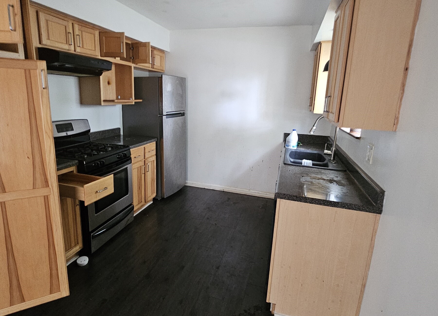 3303 Roaming Woods Lane Spring, TX 77380 - Photo 5 of 21 a kitchen with a refrigerator stove and a sink
