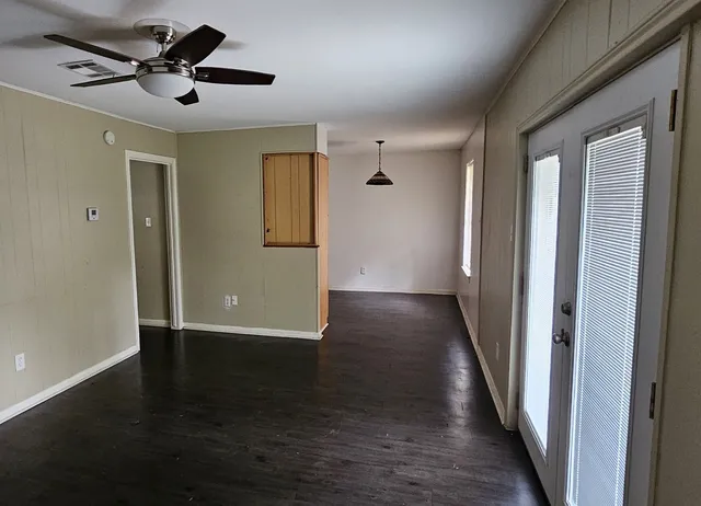 a view of a livingroom with wooden floor