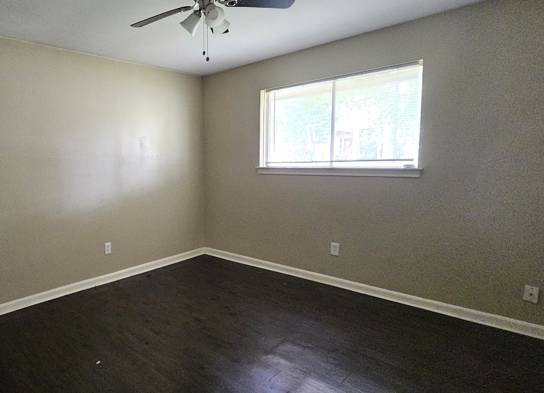 3303 Roaming Woods Lane Spring, TX 77380 - Photo 8 of 21 an empty room with wooden floor and windows