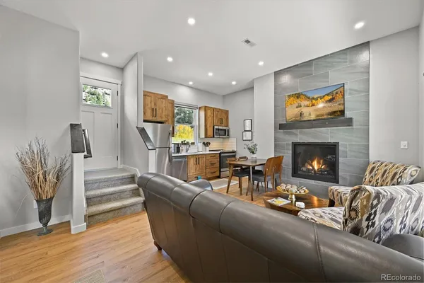 a living room with furniture and a fireplace