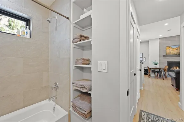 a bathroom with a tub and a shower