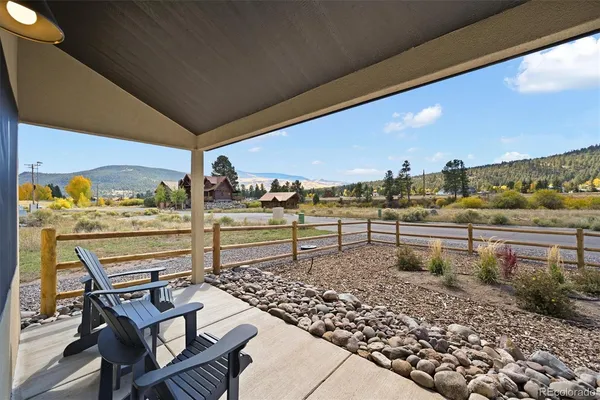 a view of a chairs and table in patio