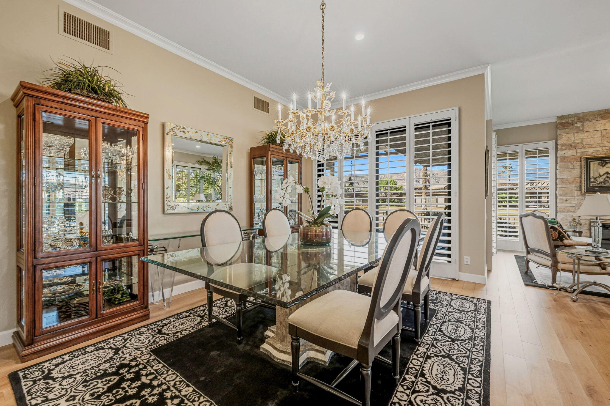 10 Whittier Court Rancho Mirage, CA 92270 - Photo 11 of 62 a view of a dining room with furniture wooden floor and chandelier